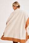 Jassen - Tweekleurige cape in tricot